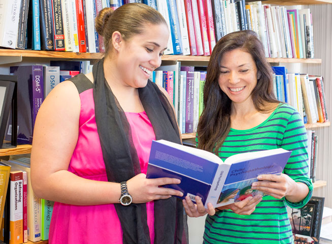 Counseling Psychology students with a book